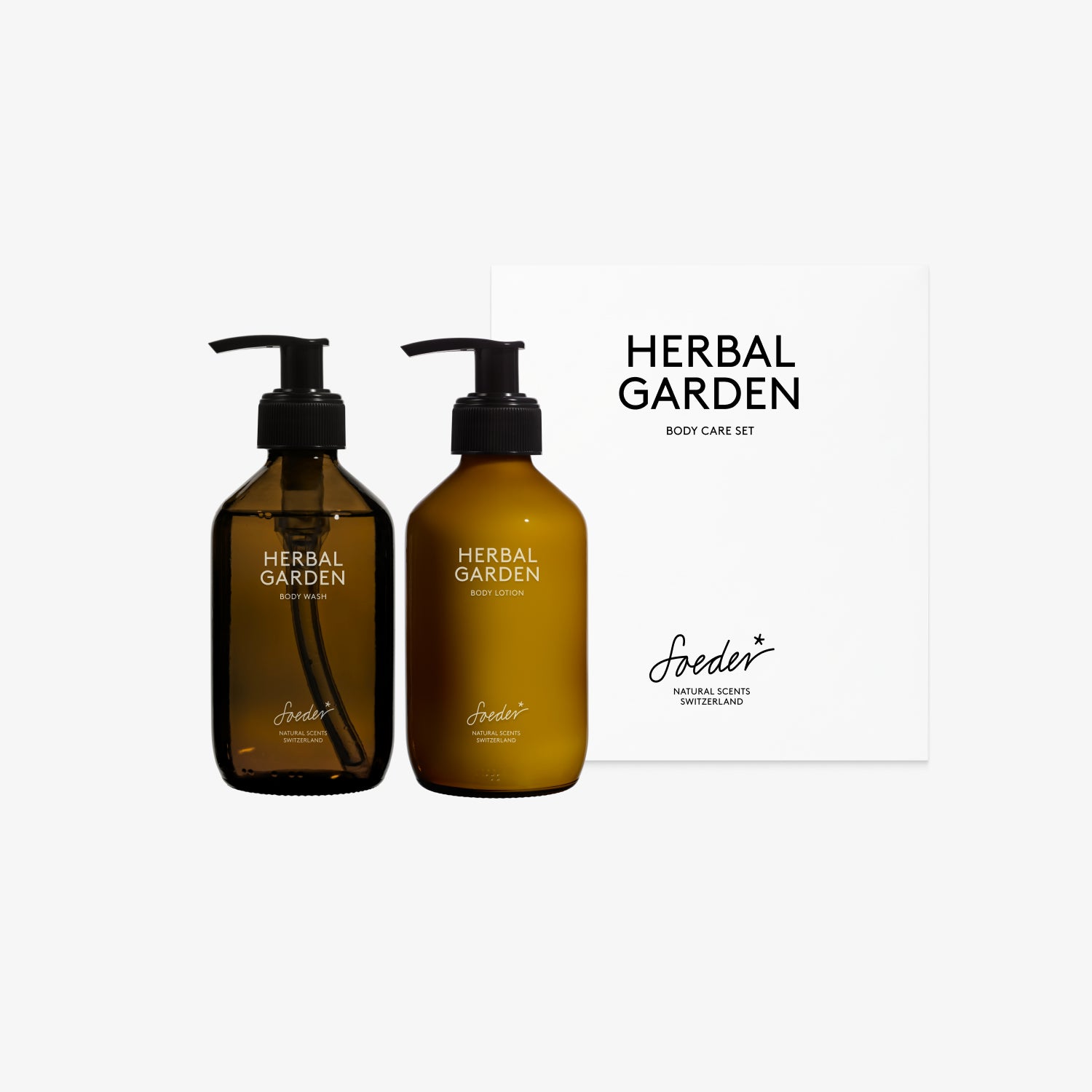 Soeder Body Care Set Herbal Garden: Body Wash und Body Lotion im Braunglas neben der weissen Geschenkbox
