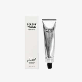 Soeder Hand Cream Serene Wood, 30 ml, in a silver tube next to a white folding box against a light gray background