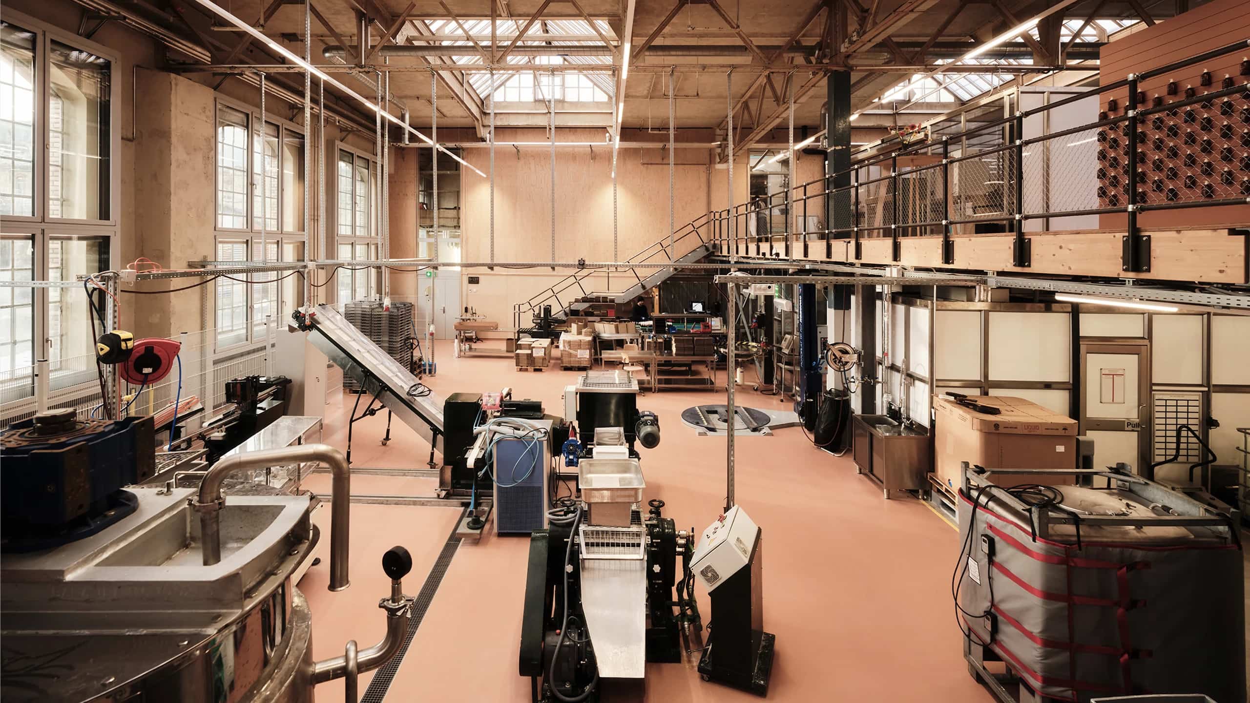 Bright production hall at Soeder Manufaktur with bottling lines and large windows